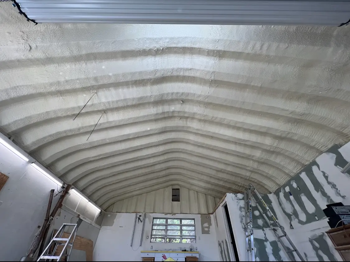 Spray polyurethane foam applied to the underside of a metal roof deck in Bellefonte